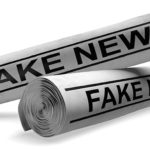 Newspapers with fake news headlines, representing outlets that p