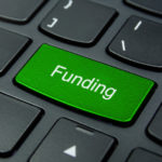 Business Concept: Close-up the Funding button on the keyboard an